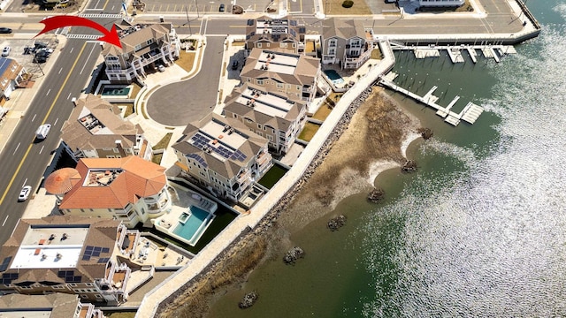 bird's eye view featuring a residential view and a water view