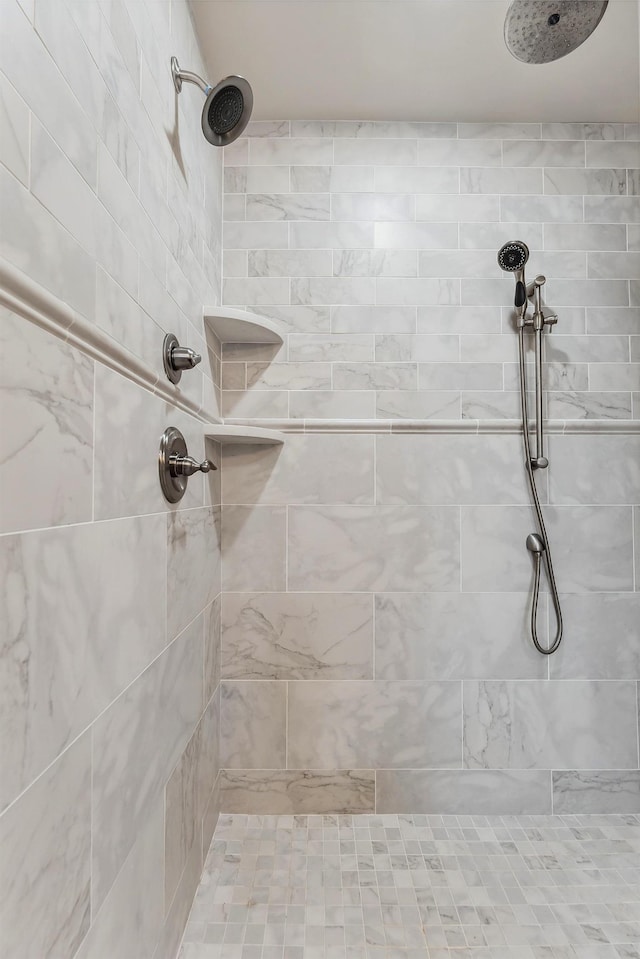 bathroom with a tile shower