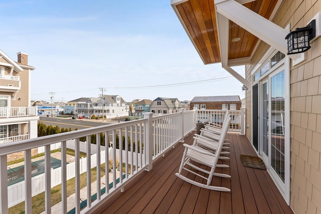 wooden deck with a residential view