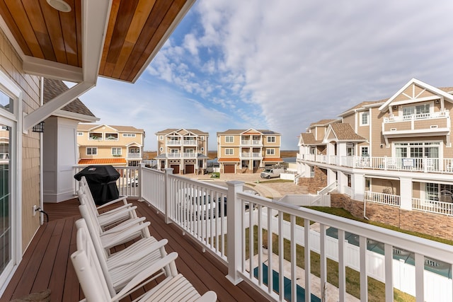 balcony with a residential view and area for grilling