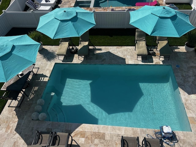 outdoor pool featuring a patio area