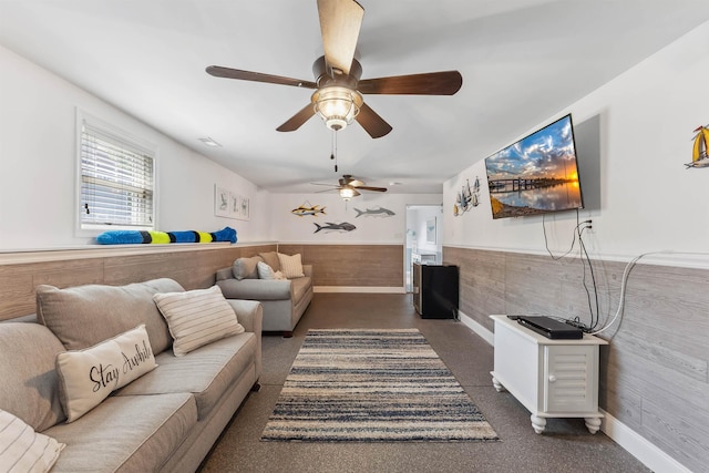 145 W Andrews Ave Unit 100, Wildwood, NJ 08260 - living room with a wainscoted wall, a ceiling fan, and carpet flooring