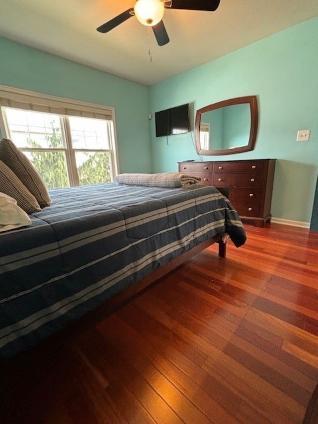 145 W Andrews Ave Unit 100, Wildwood, NJ 08260 - bedroom with wood finished floors and a ceiling fan