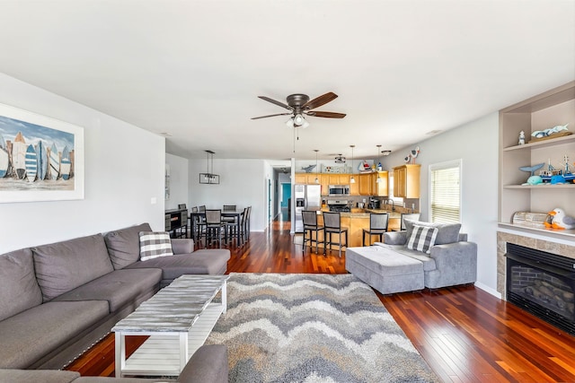 145 W Andrews Ave Unit 100, Wildwood, NJ 08260 - living room with ceiling fan, dark wood-style floors, and a tile fireplace