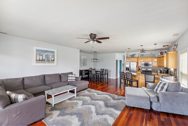 145 W Andrews Ave Unit 100, Wildwood, NJ 08260 - living area with ceiling fan and dark wood-style flooring