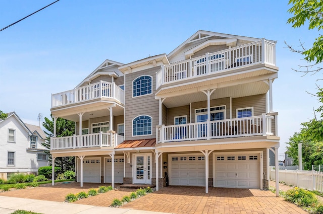 145 W Andrews Ave Unit 100, Wildwood, NJ 08260 - view of front facade with a balcony, an attached garage, and decorative driveway