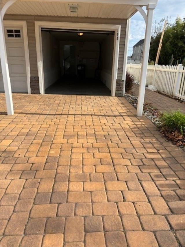 145 W Andrews Ave Unit 100, Wildwood, NJ 08260 - view of patio / terrace with driveway and a garage
