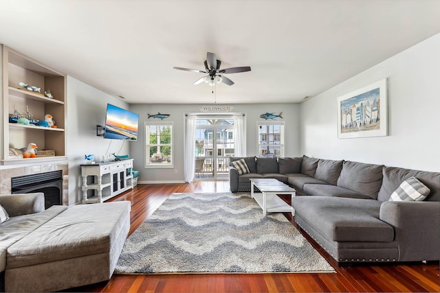 145 W Andrews Ave Unit 100, Wildwood, NJ 08260 - living room featuring a ceiling fan, wood finished floors, and a fireplace