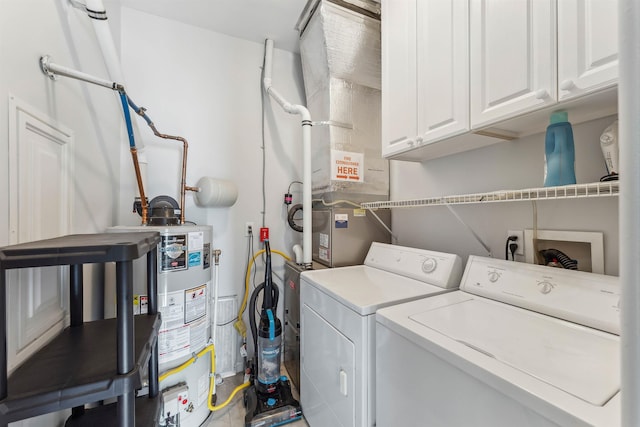 145 W Andrews Ave Unit 100, Wildwood, NJ 08260 - laundry area with washing machine and clothes dryer, water heater, cabinet space, and heating unit