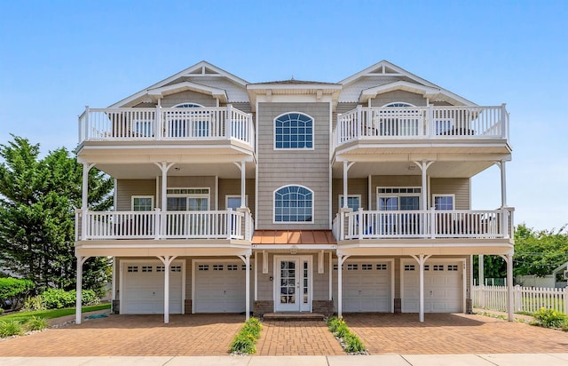 145 W Andrews Ave Unit 100, Wildwood, NJ 08260 - view of front of property with a balcony, a garage, and driveway