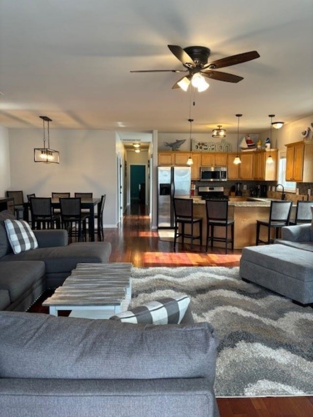 145 W Andrews Ave Unit 100, Wildwood, NJ 08260 - living area with dark wood-type flooring and ceiling fan