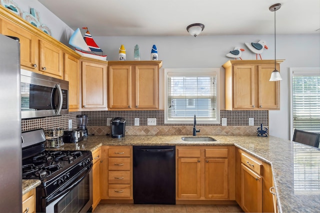 145 W Andrews Ave Unit 100, Wildwood, NJ 08260 - kitchen with appliances with stainless steel finishes, tasteful backsplash, and light stone countertops