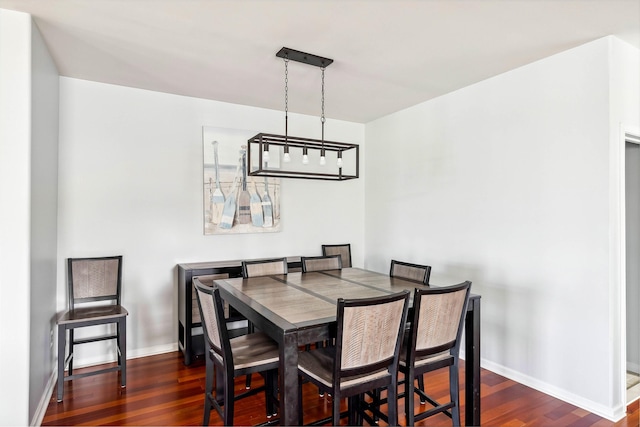145 W Andrews Ave Unit 100, Wildwood, NJ 08260 - dining area featuring dark wood-style flooring and baseboards