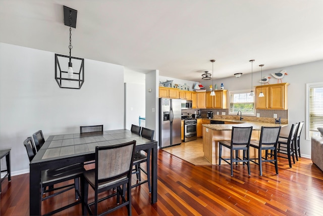 145 W Andrews Ave Unit 100, Wildwood, NJ 08260 - dining area with hardwood / wood-style flooring