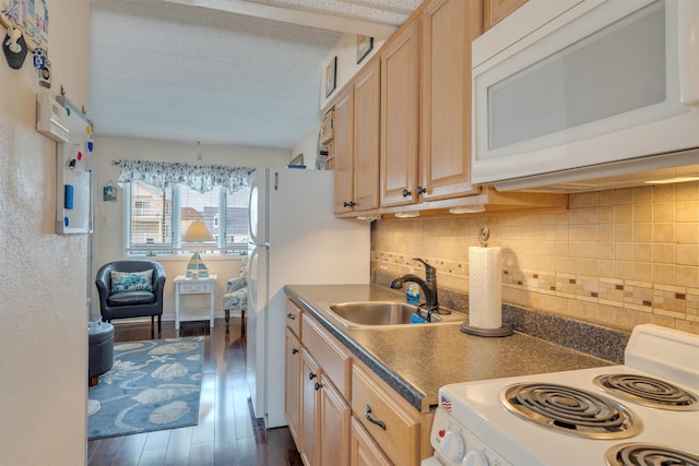 kitchen featuring light brown cabinets, sink, tasteful backsplash, dark hardwood / wood-style floors, and stove