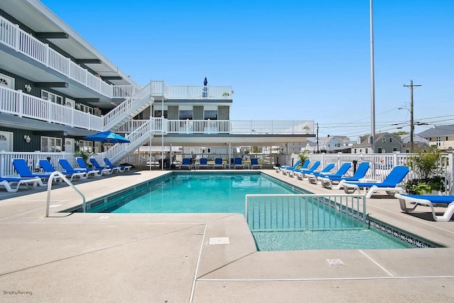 view of swimming pool with a patio area