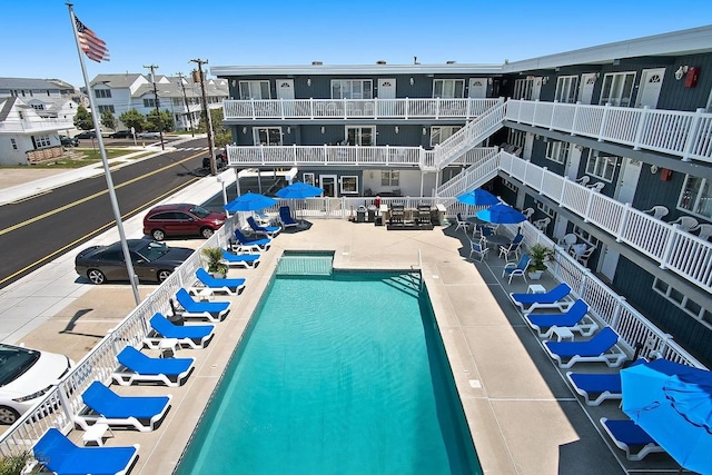 view of swimming pool with a patio