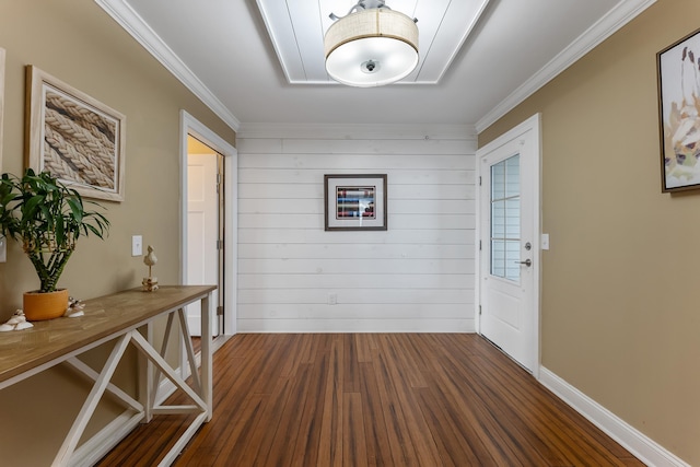 foyer with crown molding and dark wood-type flooring