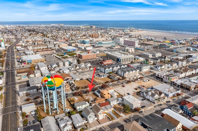 birds eye view of property featuring a view of the beach and a water view