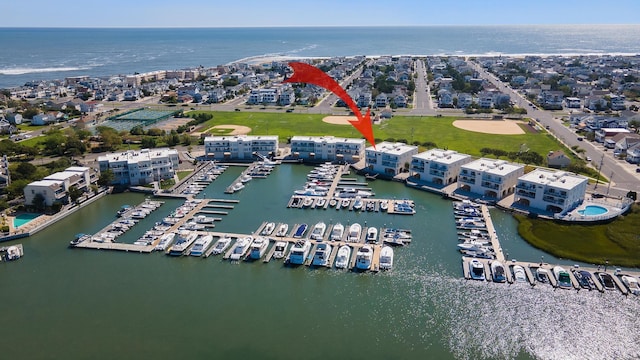 birds eye view of property featuring a water view