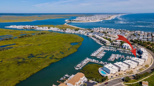 birds eye view of property featuring a water view