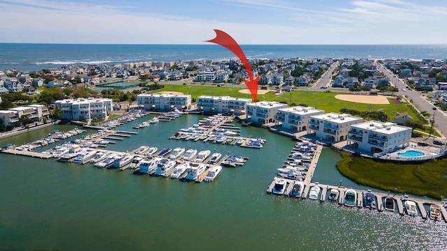 birds eye view of property featuring a water view