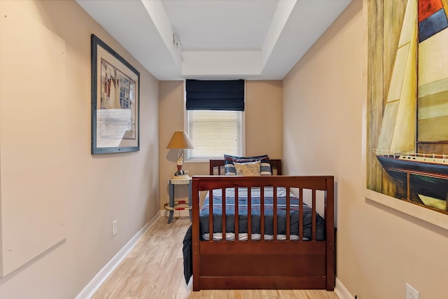 bedroom with hardwood / wood-style flooring