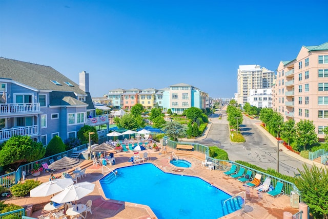 view of swimming pool with a patio