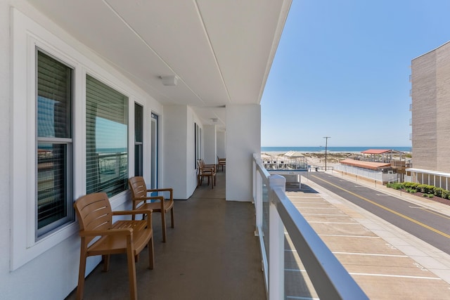 balcony featuring a water view