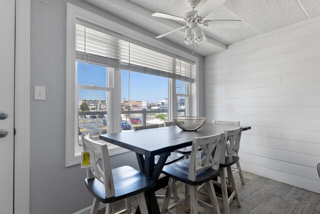 dining space featuring hardwood / wood-style flooring and ceiling fan