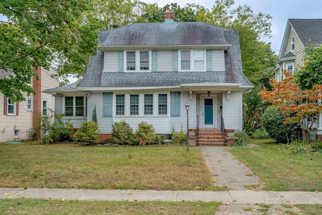 view of front of home with a front lawn