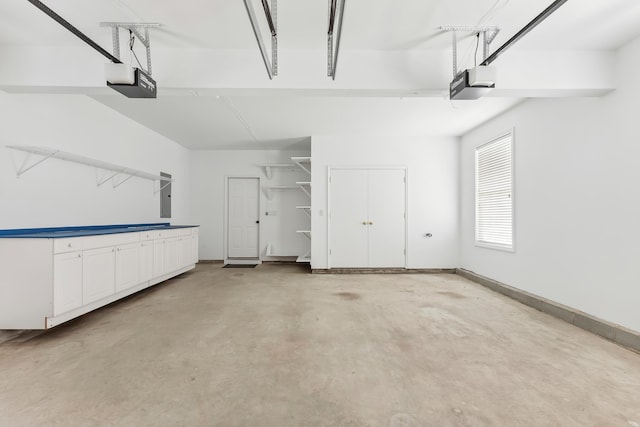 201 Saint Andrews Dr Unit 201, Swainton, NJ 08210 - garage featuring a garage door opener, electric panel, and baseboards