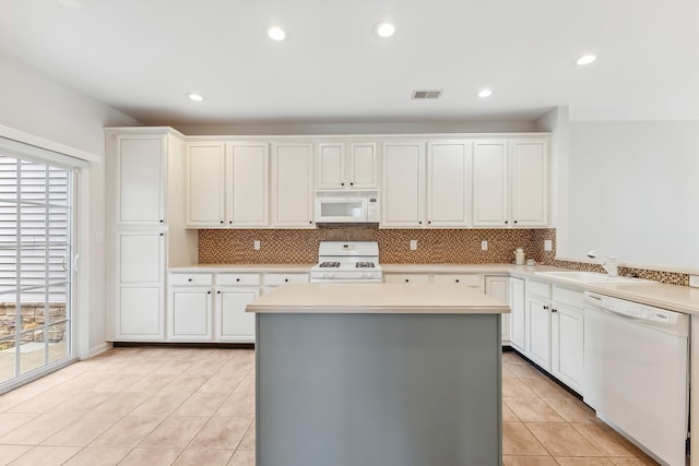 201 Saint Andrews Dr Unit 201, Swainton, NJ 08210 - kitchen featuring white appliances, light countertops, light tile patterned floors, decorative backsplash, and recessed lighting