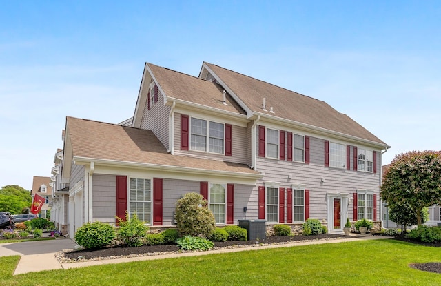 201 Saint Andrews Dr Unit 201, Swainton, NJ 08210 - colonial inspired home with a front lawn, roof with shingles, and driveway