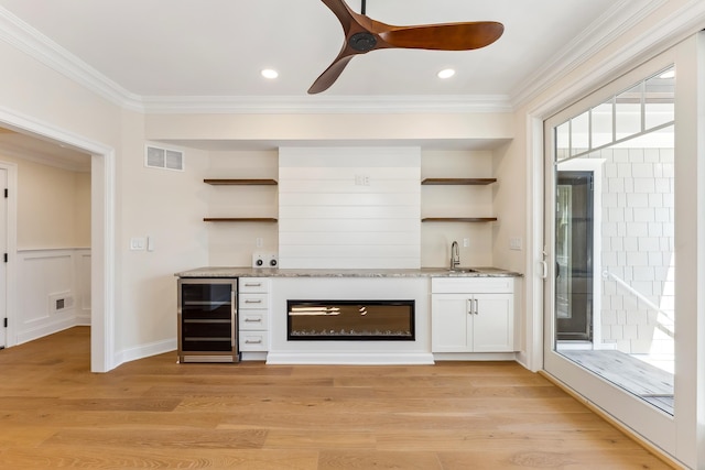427 E 5th Ave, North Wildwood, NJ 08260 - indoor wet bar with beverage cooler, ornamental molding, ceiling fan, light wood-style flooring, and recessed lighting