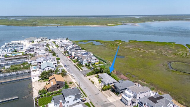 585 7th St, Avalon, NJ 08202 - aerial view of property and surrounding area featuring a large body of water and nearby suburban area