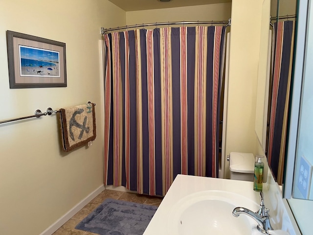 bathroom with sink, tile patterned floors, and curtained shower