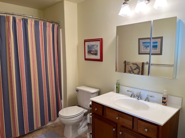 bathroom featuring toilet, curtained shower, and vanity