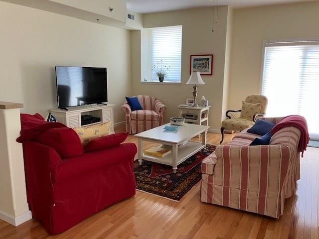 living room with light hardwood / wood-style floors