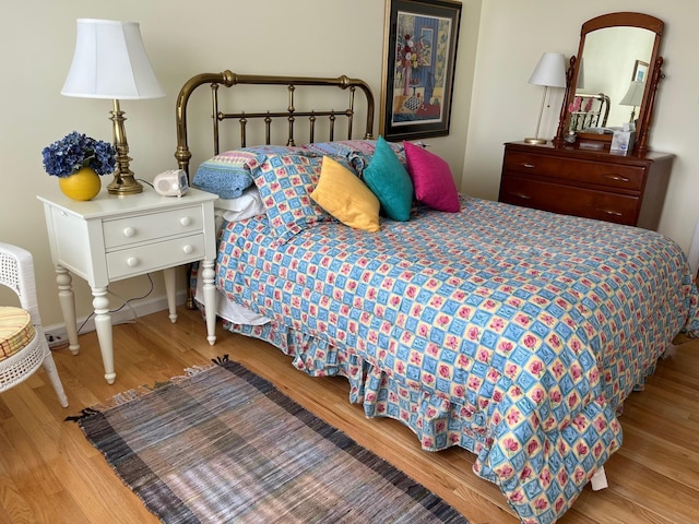 bedroom with light hardwood / wood-style floors