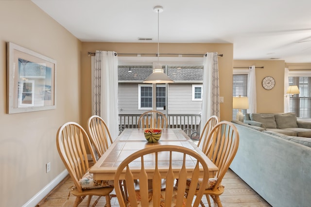 dining room with light hardwood / wood-style floors