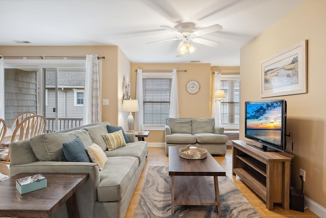 living room featuring ceiling fan