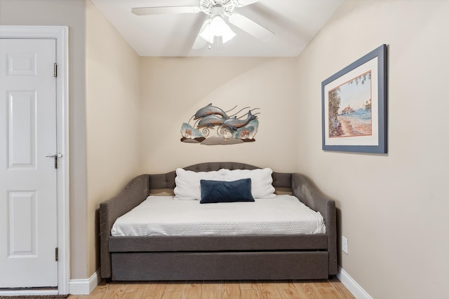 sitting room with ceiling fan and light hardwood / wood-style flooring