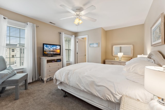 carpeted bedroom with ceiling fan