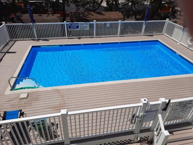 community pool with a deck