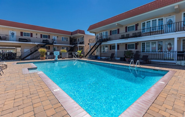 view of swimming pool featuring a patio area