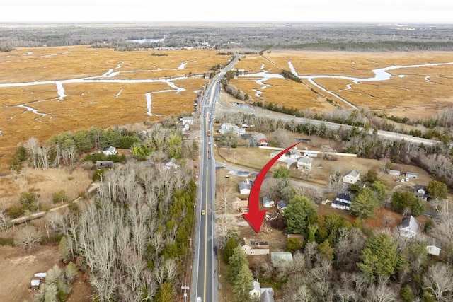 birds eye view of property with a rural view