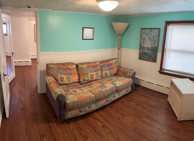 living room featuring wood finished floors, a baseboard heating unit, and baseboard heating