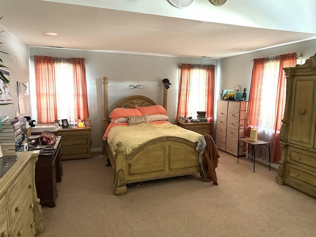 bedroom featuring light colored carpet