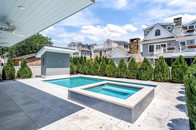 151 37th St, Avalon, NJ 08202 - view of pool with an in-ground hot tub, a patio, an outbuilding, and a residential view
